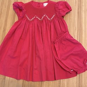 Beautiful pink smocked dress with matching bloomers.  Size 6 months.  Worn once.